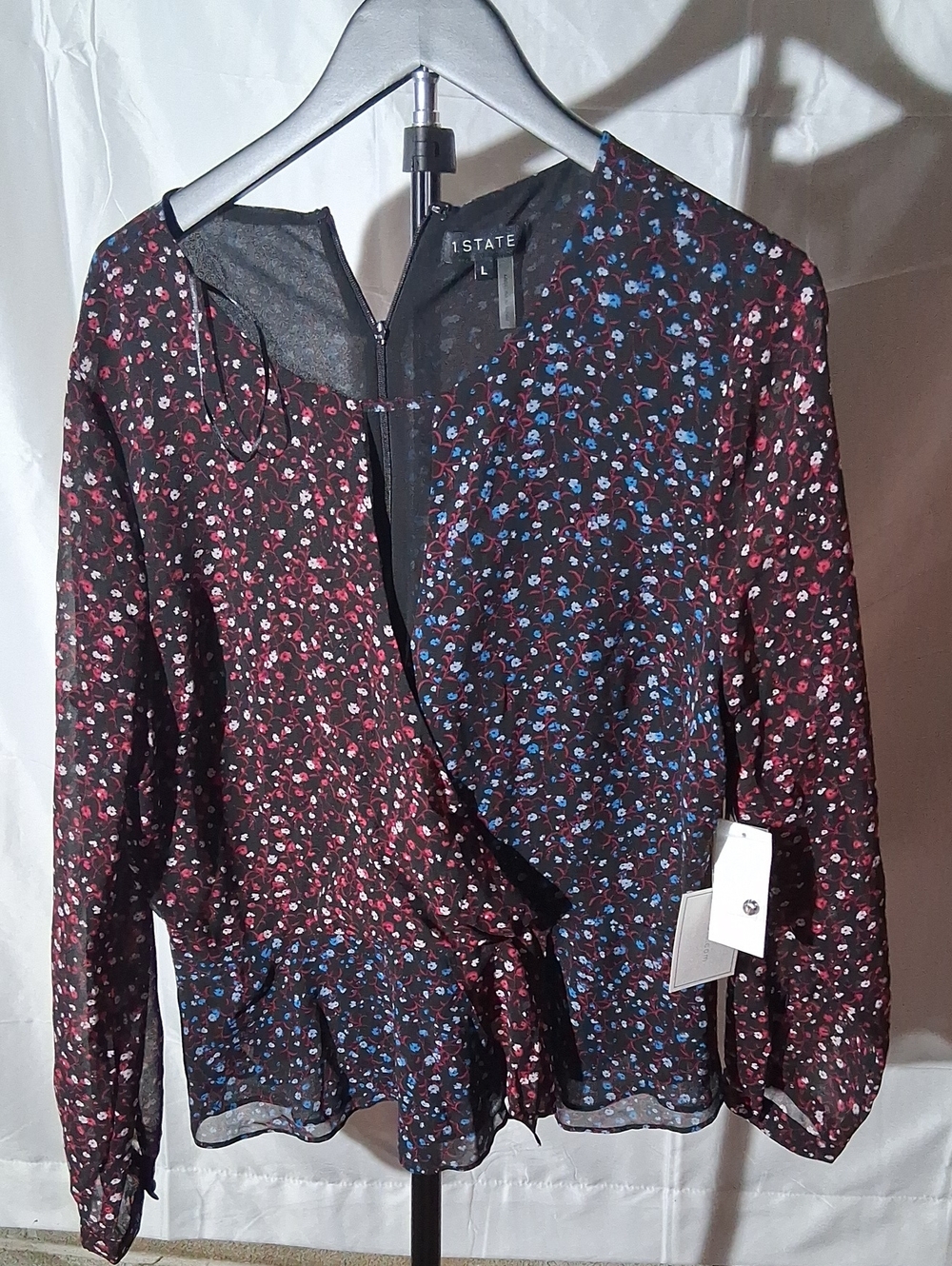 1. State Black Floral Wrap Blouse with Pink & Blue Accents